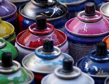 Photo of different color spray paint cans