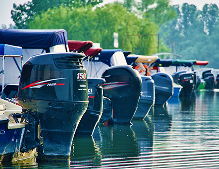 photo of small boats in marina showing just the motors