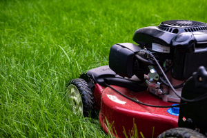Closeup photo of lawn mower in grass
