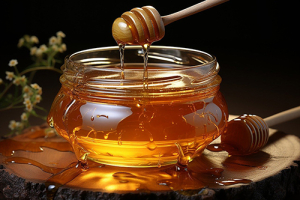Photo of honey dripping into a glass bowl